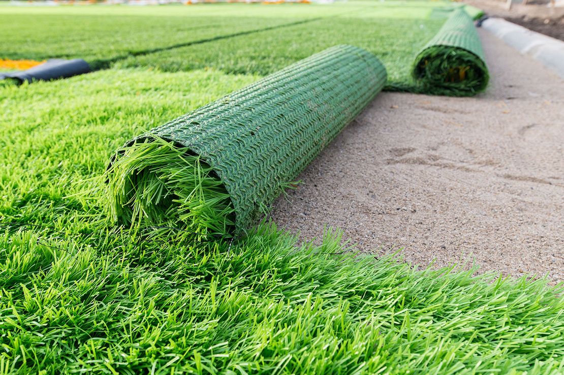 Artificial Grass being laid in a costumers garden